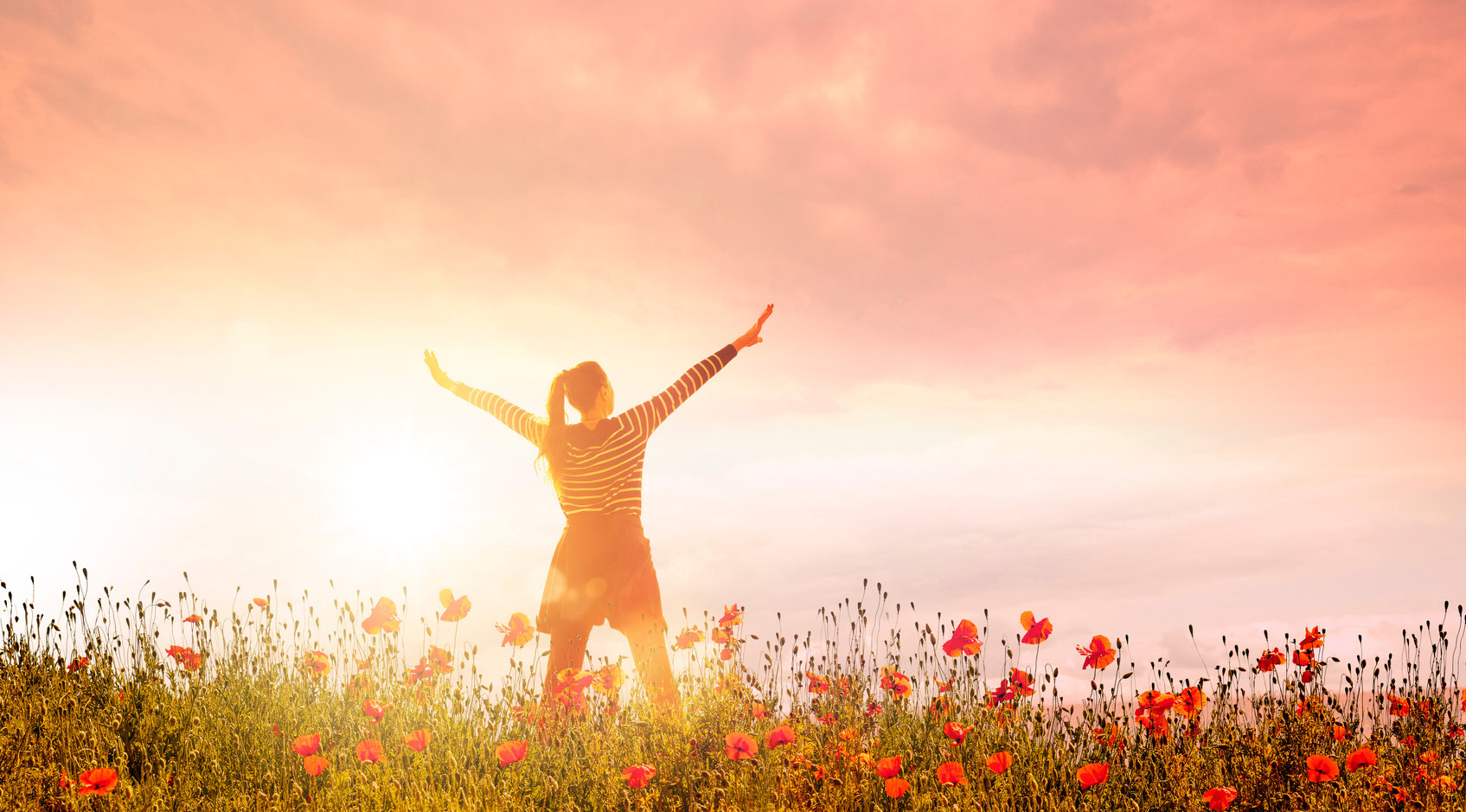 Happy woman in Poppy field